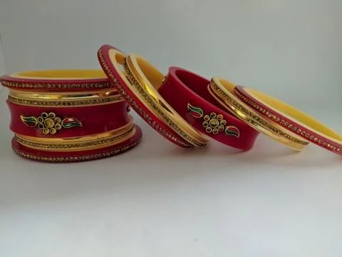 Red bangles isolated on white background - wedding  Traditional gold bangles Stock Photos