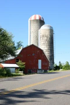 Red barn and two large silos. Taken in Old Barns, Nova Scotia 06/19/2020 Stock Photos