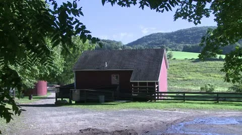 Red barn with pasture behind it Video stock 10570820