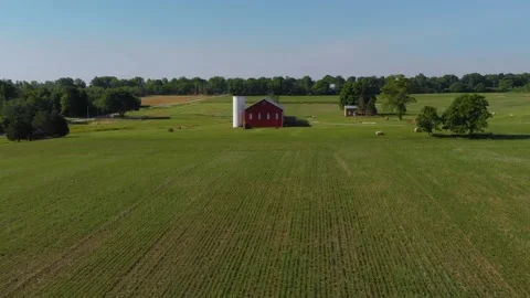 Red barn, silo, open green farm fields, Dayton Ohio, drone 4k Stock Footage 147988464