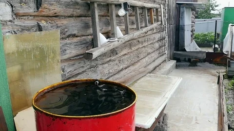 In the red barrel drips water 스톡 동영상 80040191