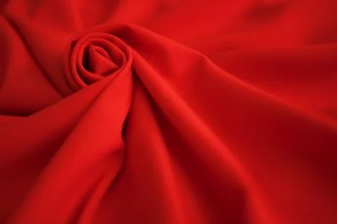 Red batiste made of cotton. sample of red soft fabric with pleats. Top view Stock Photos