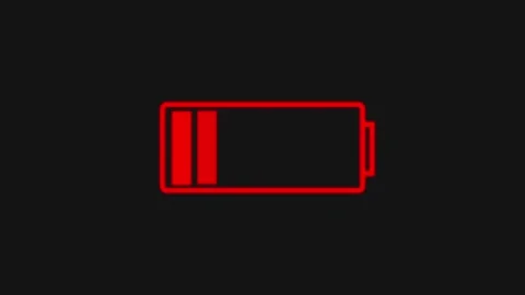 Red battery icon with low charge on black background. Battery icon power. P.. Stock Footage 337130928