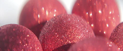 Red baubles with shiny sequins anamorphic 4K sliding video Stock Footage 317802197