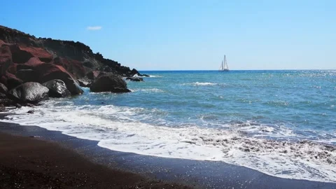 Red beach with black volcanic sand in Santorini island, Greece. Stock-Footage 242162175