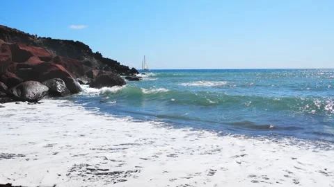 Red beach with black volcanic sand in Santorini island, Greece. Stock Footage 244107774