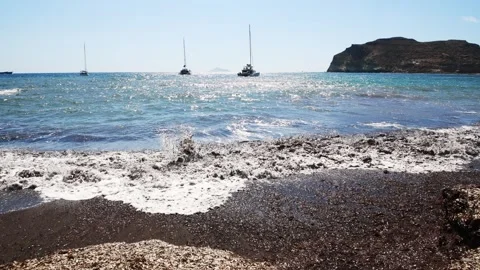 Red beach with black volcanic sand in Santorini island, Greece. Stock Footage 275172473