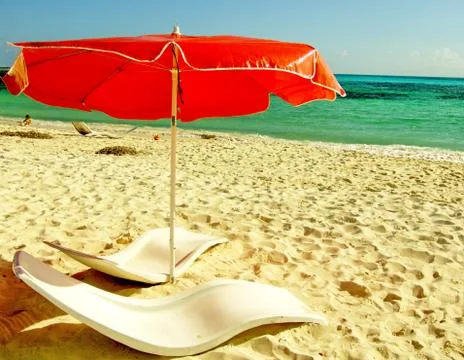 Red beach umbrella Stock Photos