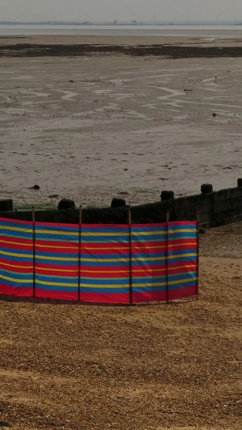 Red Beach Windbreak Fabric Barrier on Sandy Beach 4K Vertical Video 스톡 동영상 335543648