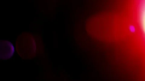 Red beam of light creates light leak into anamorphic lens along with bokeh Stock Footage 266731518