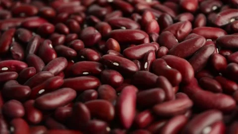 The red bean rotates. Raw beans. Side view. Stock Footage 301913935