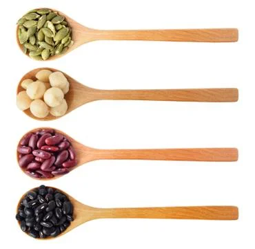 Red beans, black beans, pumpkin seeds and macadamia isolated on white Stock Photos