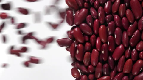 Red beans fall in slow motion and cover the whole screen, vertical video Stock Footage 172215266