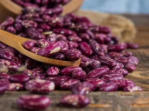 Red beans with a pattern. (Delicious variegated, raw common beans) in a woode Stock Photos