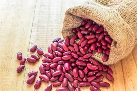 Red beans poured from the sack Stock Photos