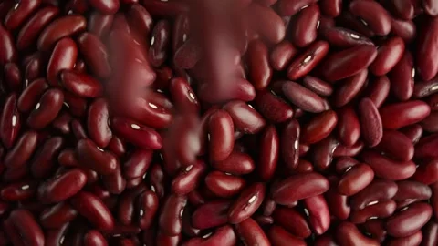 Red beans spin and spill. Raw beans. View from above. Stock Footage 288815097