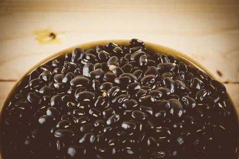 Red beans on wood background - soft focus with vintage film filter Stock Photos
