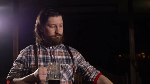 Red Bearded man drinking beer in a bar 스톡 동영상 71454018
