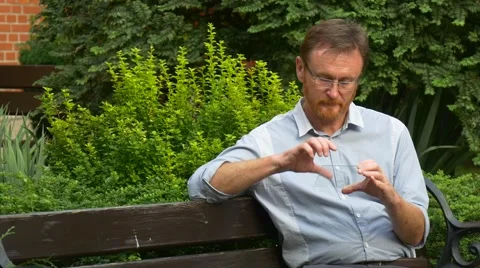 Red-Bearded Man Holds a Tablet Computer in a Hand Stock Footage 67553577
