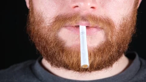 Red-bearded man smoking Stock Footage 257698810