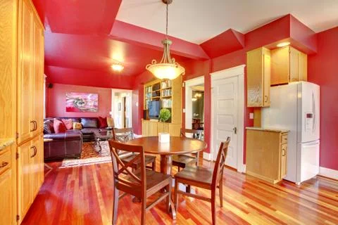 Red beautiful large kitchen with cherry hardwood. Stock Photos