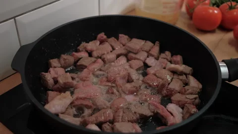 Red beef meat is fried in a frying pan. Healthy food. Proper nutrition Stock Footage 262435943