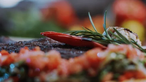Red beef steak cooked medium well cut sliced knife on a cutting board roast Stock Footage 100304811