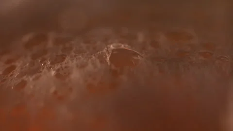 Red beer macro bubbles Stockbeeldmateriaal 242271595