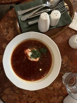 Red beetroot soup served with sour cream Stock Photos