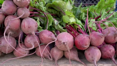 Red beets with leaves on the market counter Stock Footage 132444853