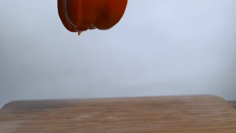 Red bell pepper break into pieces in slow motion Stock Footage 100008168