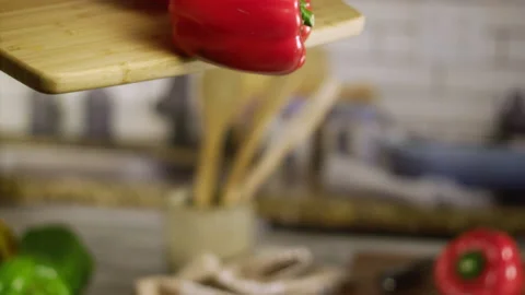 Red bell pepper falling from cutting table in slow motion Stock Footage 152904117