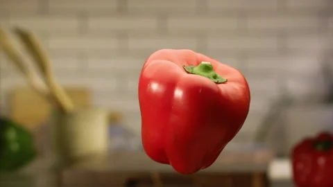 Red bell pepper jumping in slow motion Stock Footage 152903323