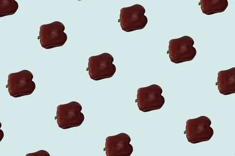 Red bell pepper pattern on a blue background. View from above. Food backgro.. Stock Photos