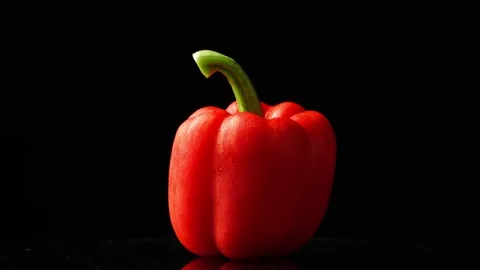 Red bell pepper rotating, black background Stock Footage 151336378