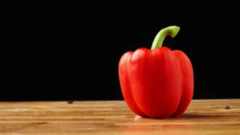 Red bell pepper rotating, black background Stock Footage 151336482