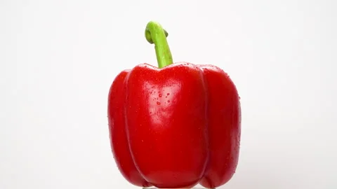 Red Bell Pepper Rotating On White Background With Water Drops Stock Footage 325566776