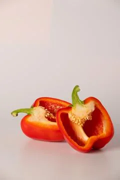 Red bell pepper in section close-up on a white background Foto stock
