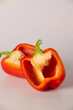 Red bell pepper in section close-up on a white background Fotos de archivo