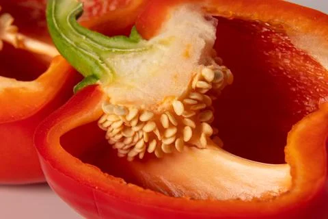Red bell pepper in section close-up on a white background Fotos de archivo