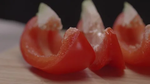 Red bell pepper sliced on a chopping board. Stock Footage 313971416