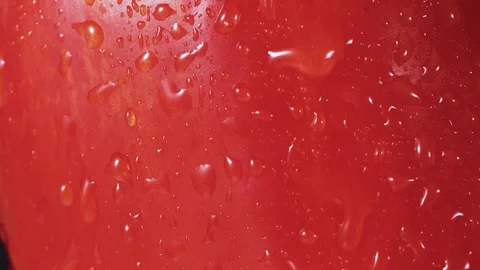 Red bell pepper spray close up, drops of water going down Stock Footage 102568632