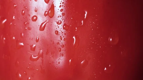 Red bell pepper spray close up, drops of water going down Stock Footage 102568928