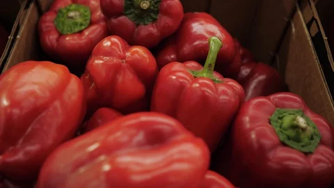 Red bell pepper at the store. Eco pepper at the store products close up. Stock Footage 128623926