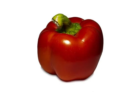 Red bell pepper on a white background. A healthy vegetable in droplets of wat Stock Photos