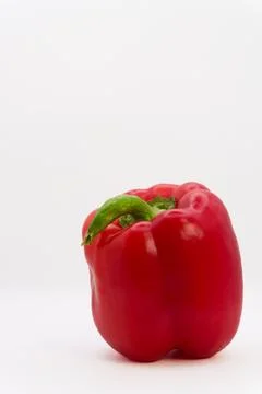 Red bell pepper on a white background, healthy eating from fruits and vegetables Stock Photos