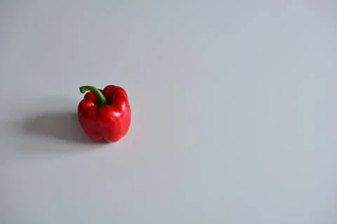 Red bell pepper on a white table Stock Photos