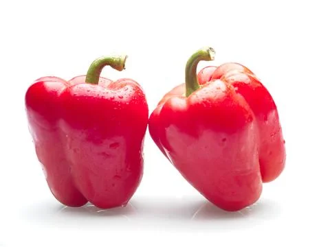 Red bell peppers on white background. Stock Photos