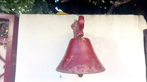 Red bell on wall, Marina di Carrara, Italy, September 5 2026 Stock Footage 344760475