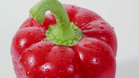Red bellpepper on white background with droplets and splash water Stock Footage 147284148